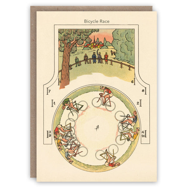 Vintage-style greeting card illustrating bicyclists racing on road bikes around a circular track with spectators looking on. 