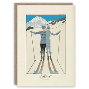 Greeting card illustrating two skiers kissing on the slopes. A Valentines or Christmas card.