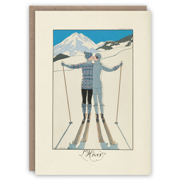 Greeting card illustrating two skiers kissing on the slopes. A Valentines or Christmas card.